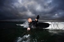 Man in kayak rotating — Stock Photo