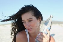 Girl holding water bottle — Stock Photo