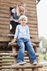 Children climbing out of playhouse, selective focus — Stock Photo