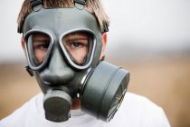 Boy wearing gas mask, selective focus — Stock Photo