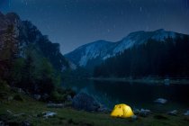 Scenic view of campsite and night sky — Stock Photo