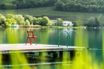 Chair on wooden pier — Stock Photo