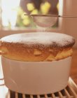 Fresh baked souffle with sugar powder sifting on it — Stock Photo