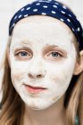 Close up of girl using face mask — Stock Photo