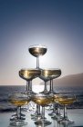 Champagne glasses in pyramid shape — Stock Photo