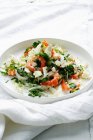 Plate of shrimp salad on white tablecloth — Stock Photo