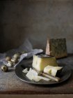 Asiago and stilton cheese with quail eggs — Stock Photo
