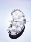 Cotton balls and syringe — Stock Photo
