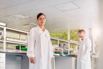 Scientist in laboratory looking at camera — Stock Photo