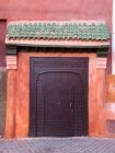 Ornate metal door on street — Stock Photo
