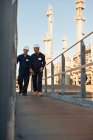 Workers walking at oil refinery — Stock Photo
