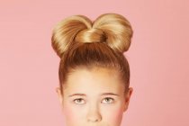 Teenage girl with ornate hairdo — Stock Photo
