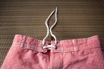 Red and white gingham swimming trunks — Stock Photo