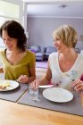 Smiling women having lunch together — Stock Photo