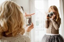Girls taking pictures of each other — Stock Photo