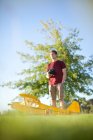 Man playing with toy airplane in park — Stock Photo
