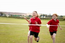 Girls racing to cross finish line, selective focus — Stock Photo