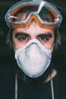 Portrait of male metalworker in dust mask — Stock Photo