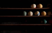 Pool balls on shelves — Stock Photo