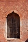 Ornate window in sand wall — Stock Photo