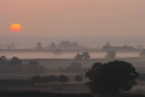 Sonnenuntergang über der ländlichen Szene — Stockfoto