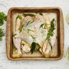 Close-up view of uncooked marinated chicken with mustard sauce — Stock Photo