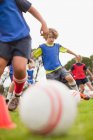 Childrens soccer team training on pitch — Stock Photo