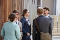 Business people talking in courtyard — Stock Photo
