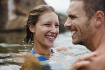 Couple swimming in lake together — Stock Photo
