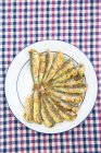Cooked sardines on plate — Stock Photo
