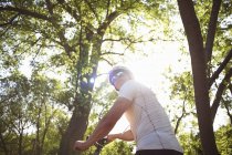 Cyclist riding in forest — Stock Photo
