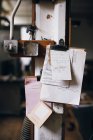 Clipboard and notes on pillar — Stock Photo