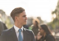 Side view portrait of businessman in suit looking away — Stock Photo