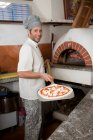 People in a pizzaria — Stock Photo