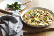 Frying pan with salmon and chickpea frittata — Stock Photo