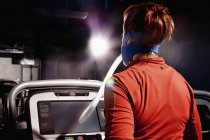 Female athlete with face mask running on gym treadmill in altitude center — Stock Photo