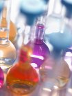 Laboratory glassware flasks containing chemicals in a laboratory — Stock Photo