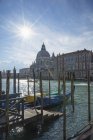 Gondolas on Grand Canal with view of church — Stock Photo