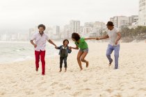 Three generation family enjoying beach,  Rio de Janeiro, Brazil — Stock Photo