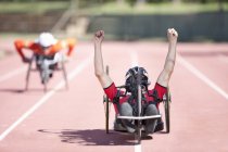Athletes at finishing line in para-athletics competition — Stock Photo