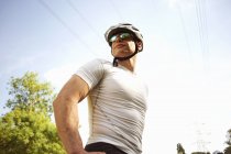 Cyclist stopping for break outdoors, low angle view — Stock Photo
