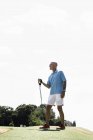 Mature male stretching with exercise rope in park — Stock Photo