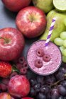 Still life of fresh fruit and raspberry smoothie — Stock Photo