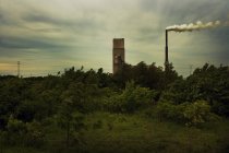 Distant view of Factory chimney with smoke — Stock Photo