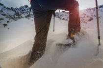 Climber wearing snow shoes walking through deep snow, Monte Rosa, Piedmont, Italy — Stock Photo