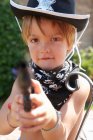 Boy in sheriff hat with gun — Stock Photo