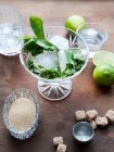 Glass with ice and mint, lime and sugar — Stock Photo