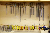 Carpentry tools stored in handmade cupboard — Stock Photo