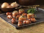 Roast stuffed bacon rolls with rosemary — Stock Photo