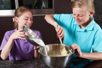Girls cooking in the kitchen — Stock Photo